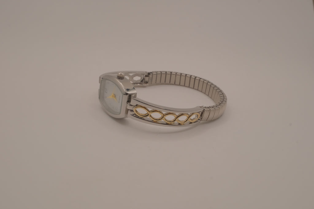 Two-tone filigree expansion watch