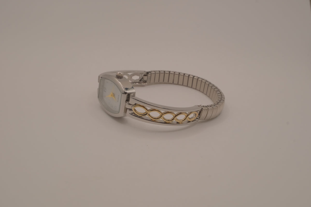 Two-tone filigree expansion watch
