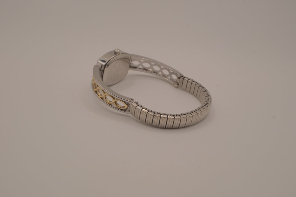 Two-tone filigree expansion watch