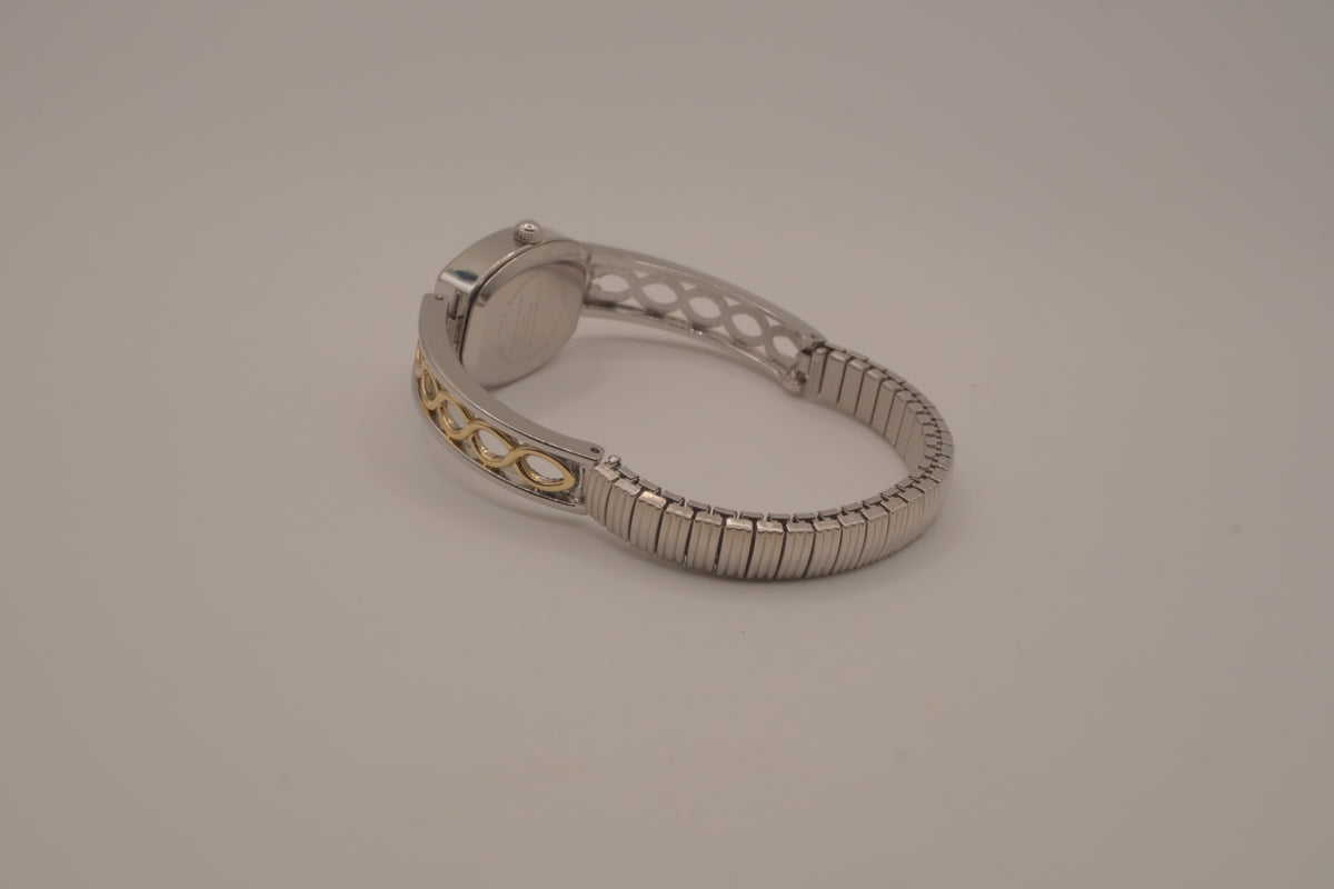 Two-tone filigree expansion watch
