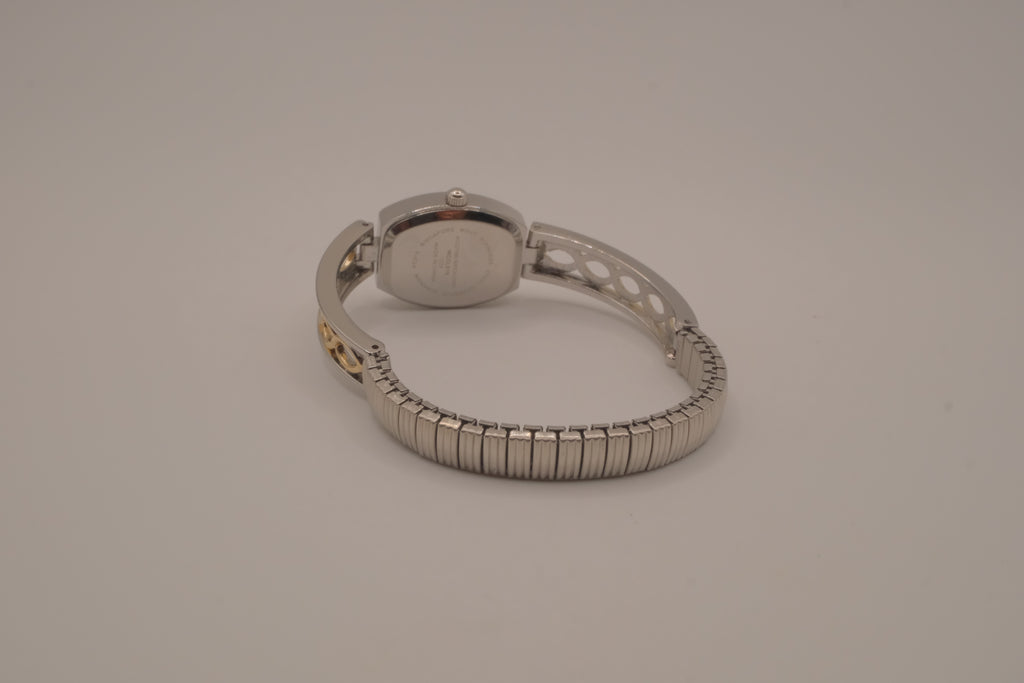 Two-tone filigree expansion watch
