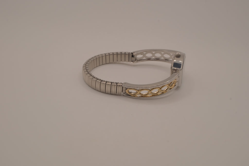 Two-tone filigree expansion watch