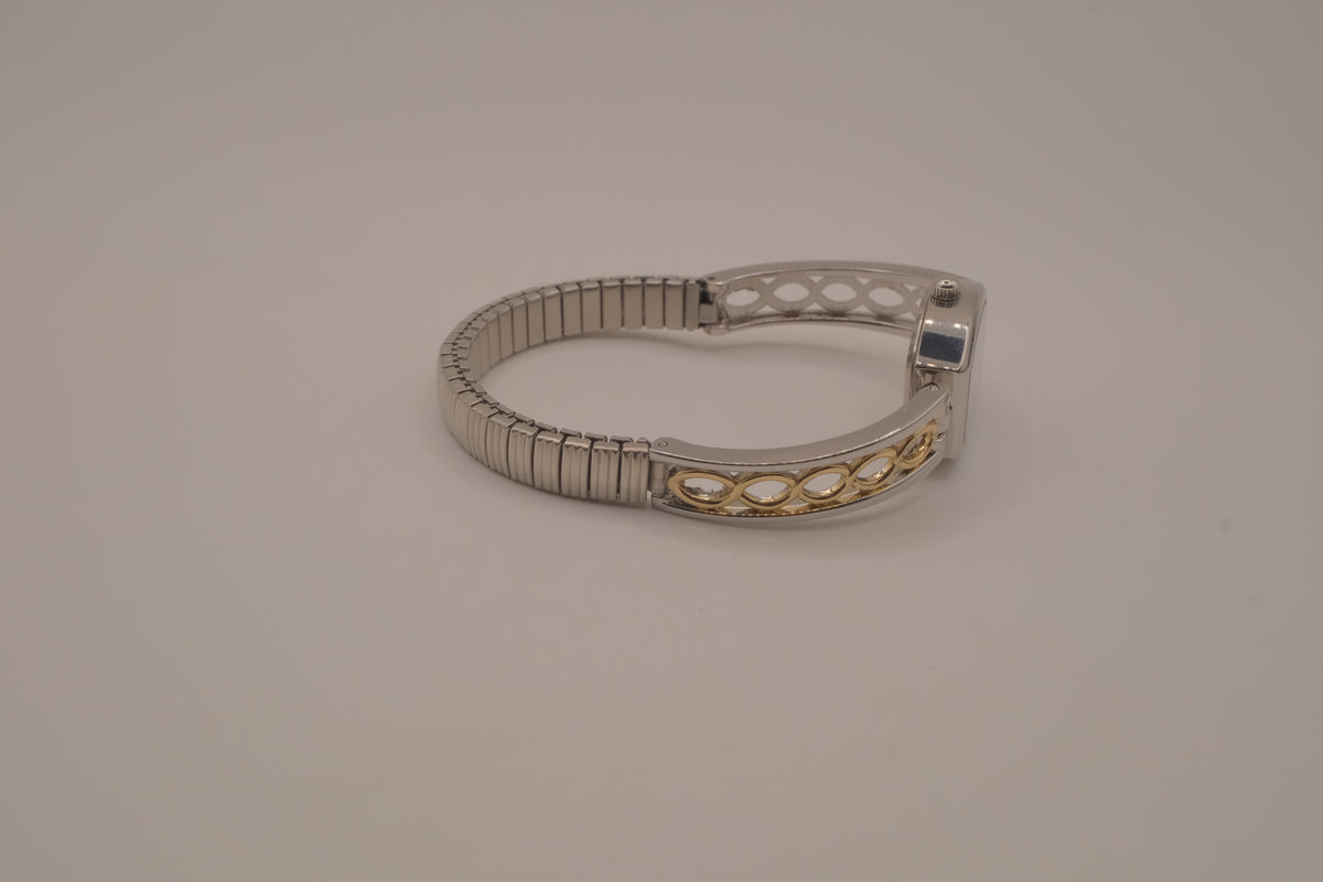 Two-tone filigree expansion watch