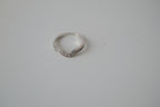 Silver tone white stone curved "wishbone" ring