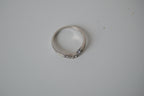 Silver tone white stone curved "wishbone" ring