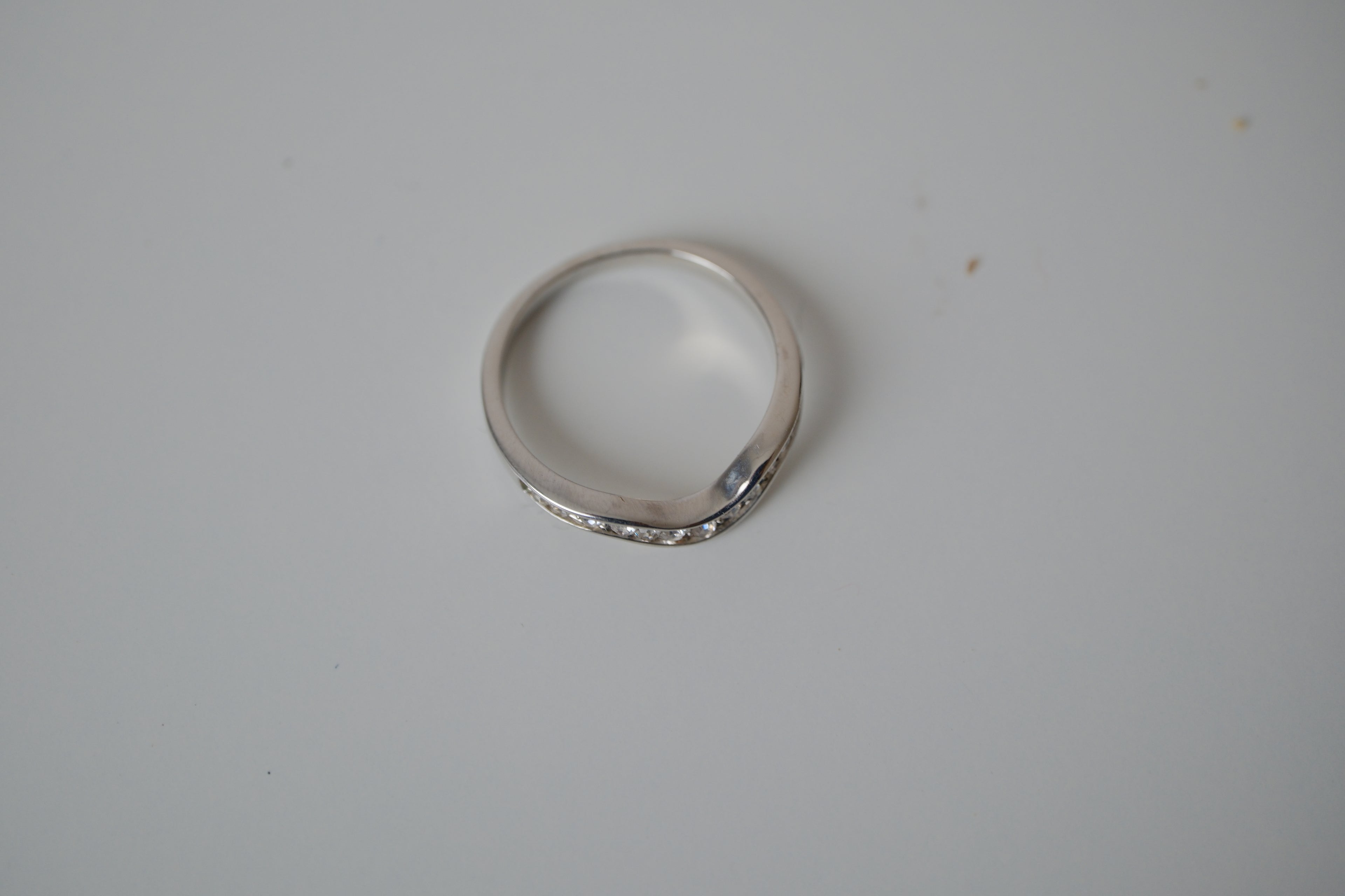 Silver tone white stone curved "wishbone" ring