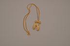 Gold toned ballet slipper pendant necklace