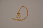Gold toned ballet slipper pendant necklace