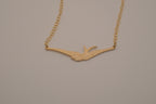 Horizontal flying bird necklace