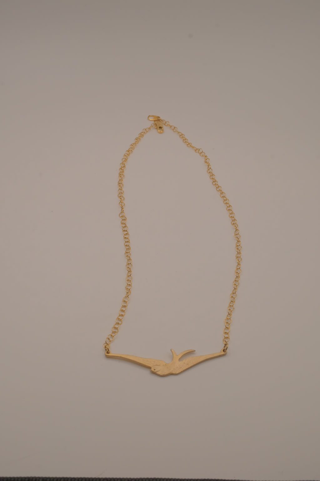 Horizontal flying bird necklace