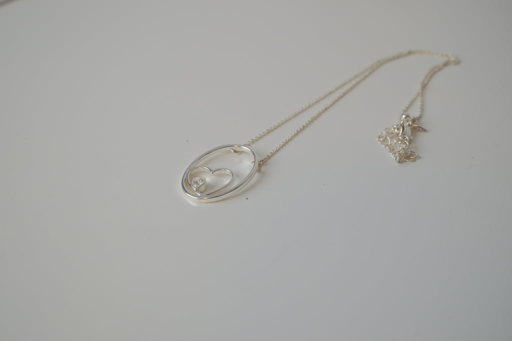 Floating heart pendant necklace