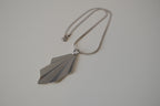 Geometric silver tone pendant necklace