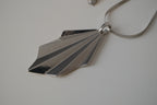 Geometric silver tone pendant necklace