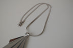 Geometric silver tone pendant necklace