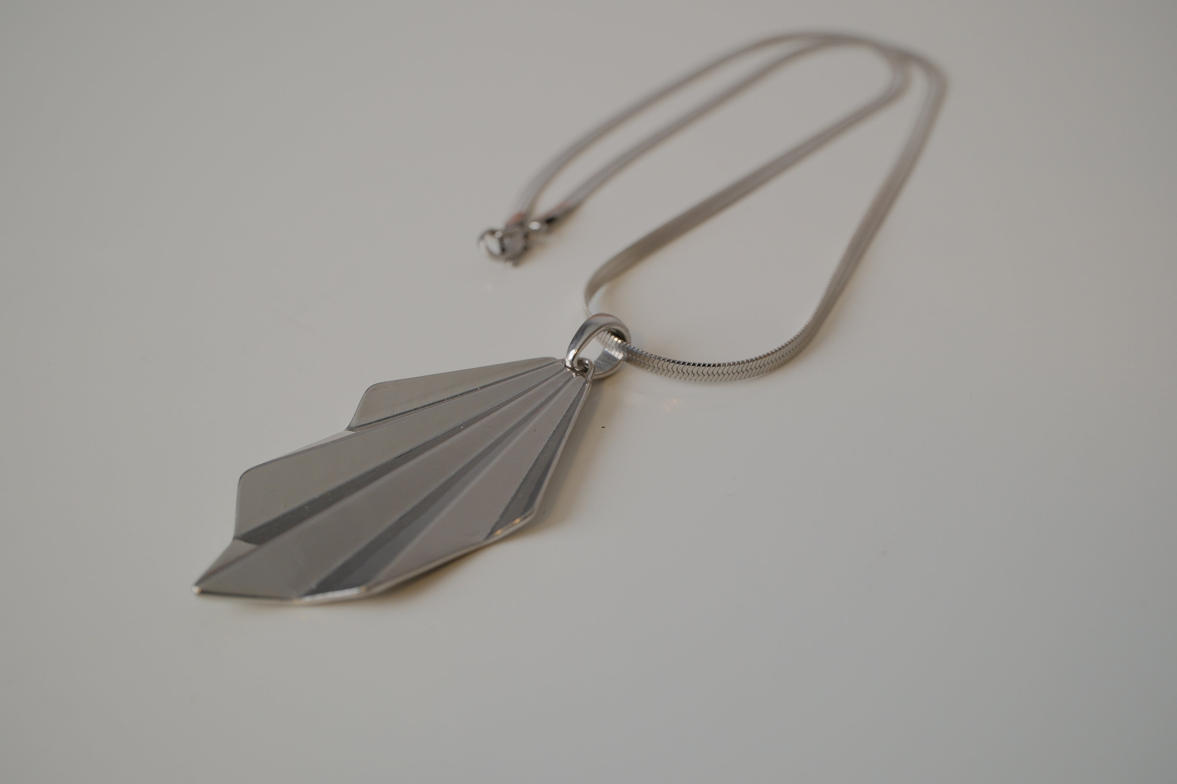 Geometric silver tone pendant necklace