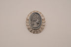 Vintage neoclassical hematite glass cameo brooch
