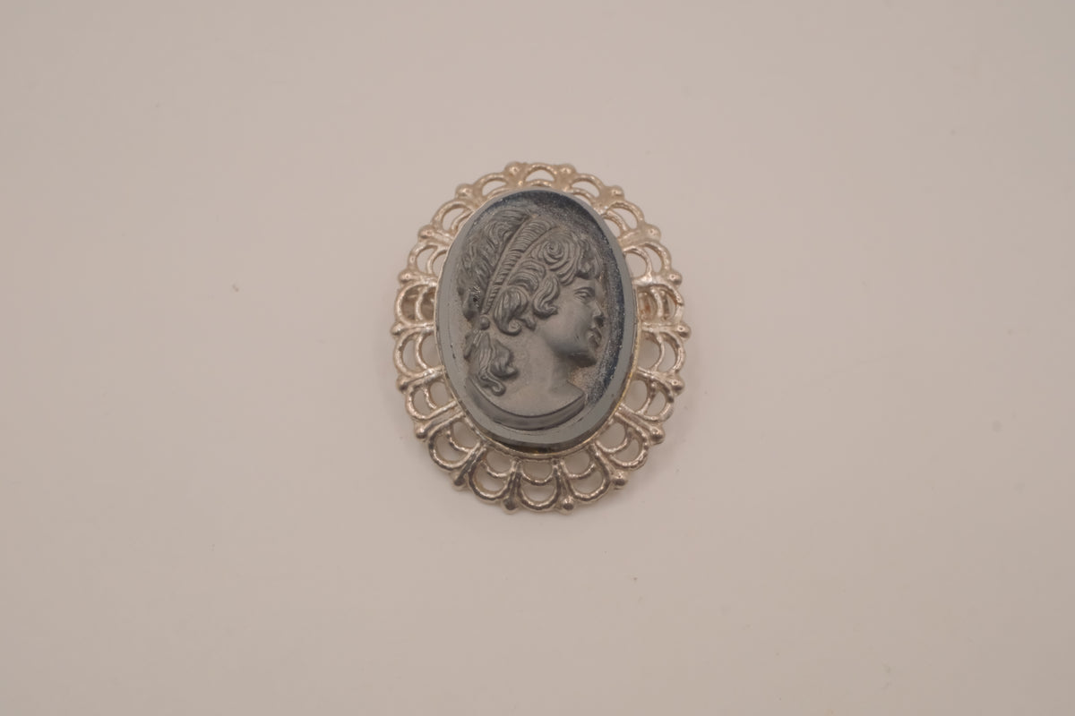 Vintage neoclassical hematite glass cameo brooch