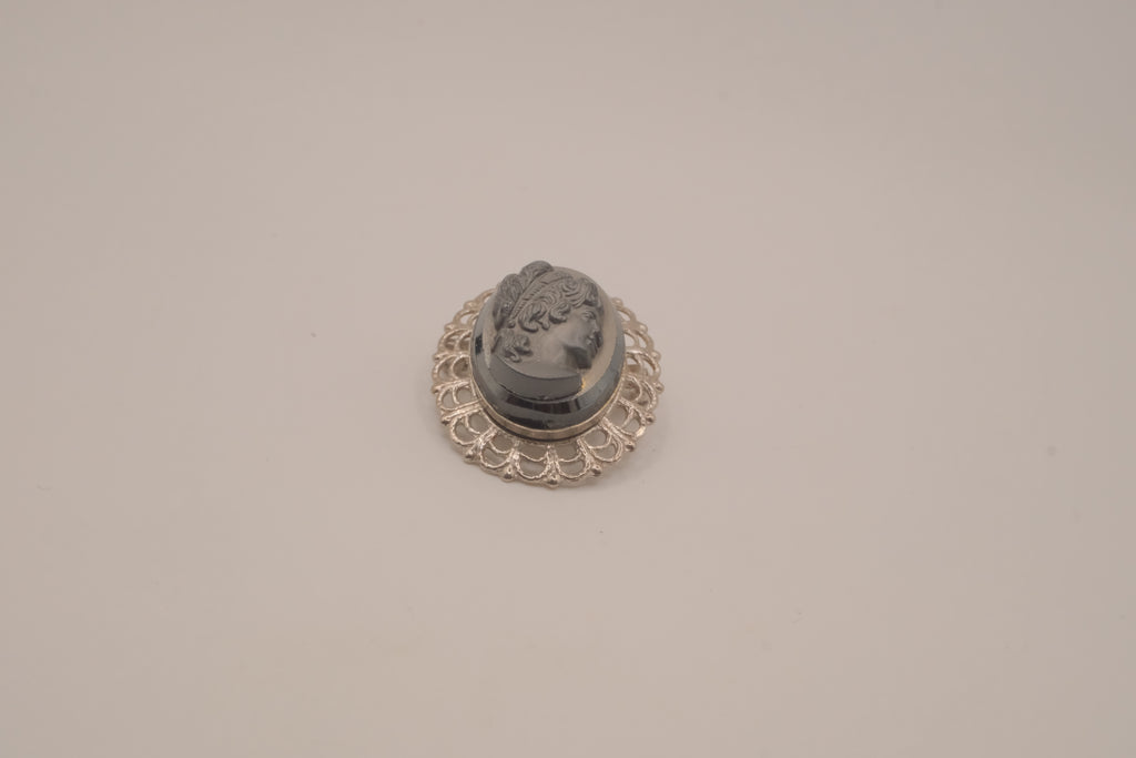 Vintage neoclassical hematite glass cameo brooch