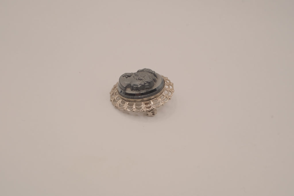 Vintage neoclassical hematite glass cameo brooch