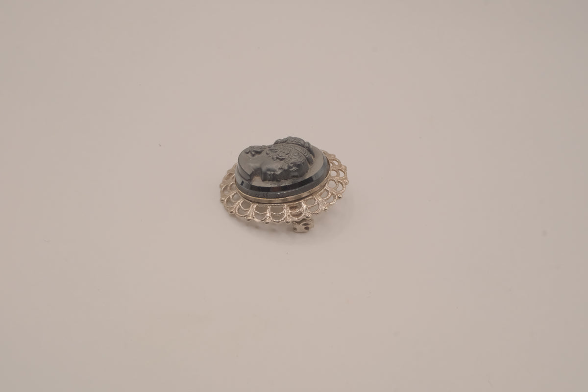 Vintage neoclassical hematite glass cameo brooch