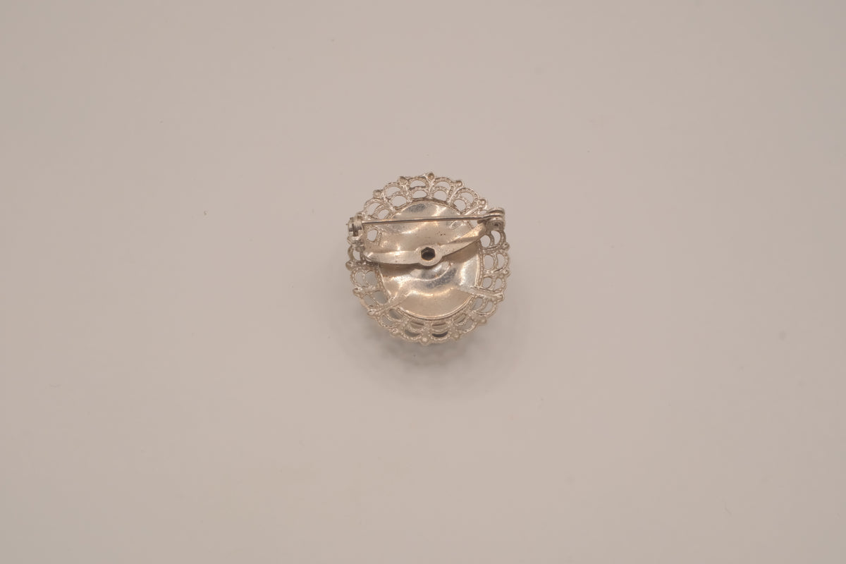 Vintage neoclassical hematite glass cameo brooch