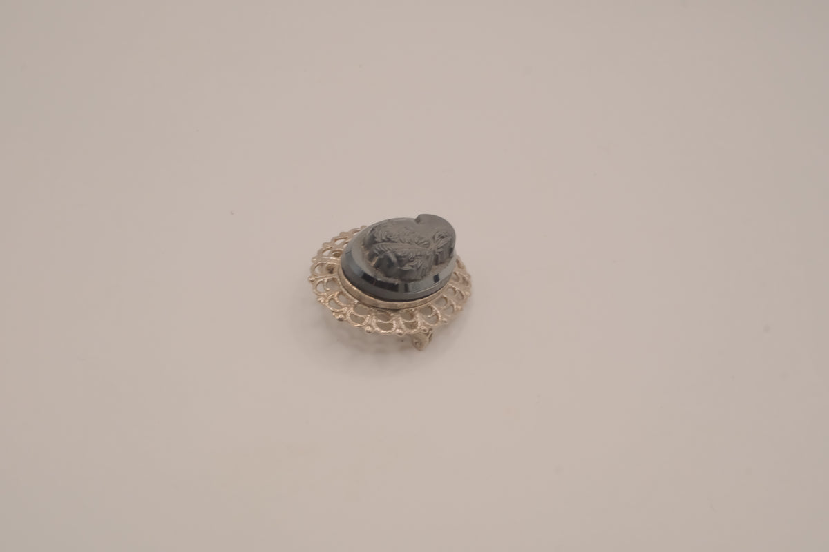 Vintage neoclassical hematite glass cameo brooch