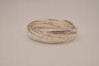 Silver tone rolling bangle bracelet