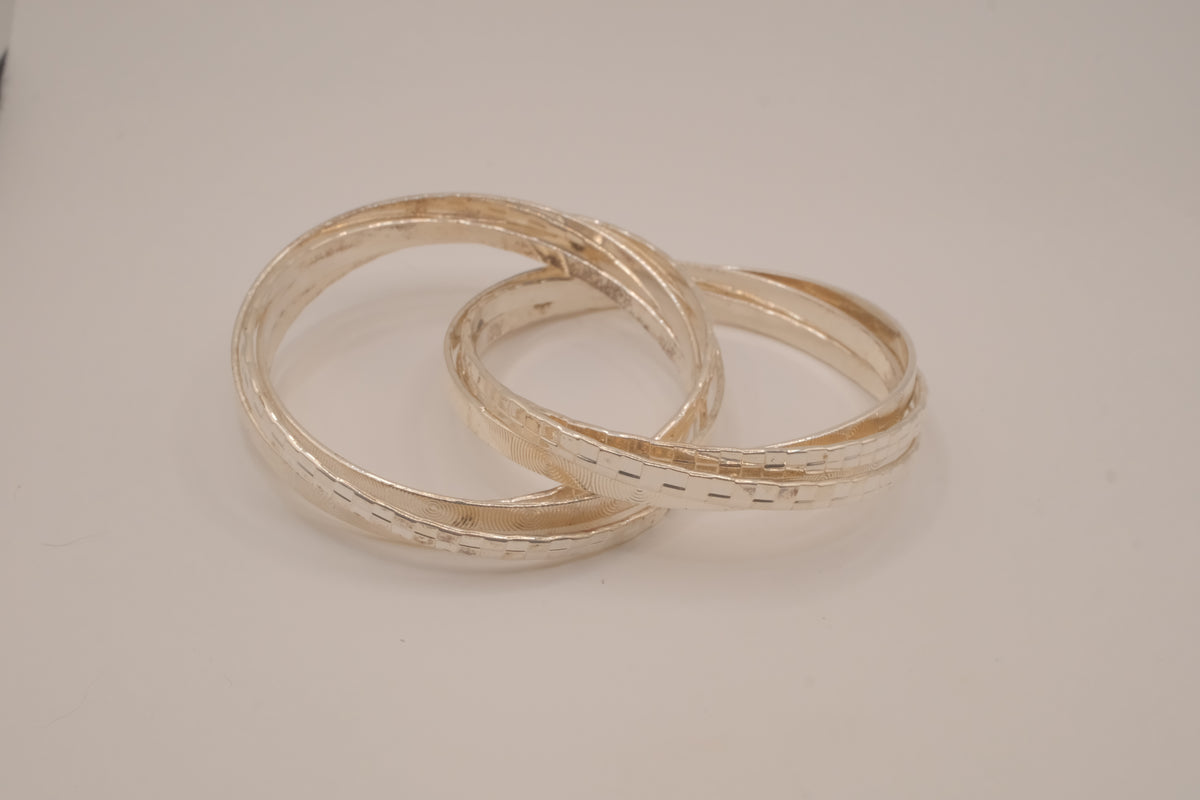Silver tone rolling bangle bracelet