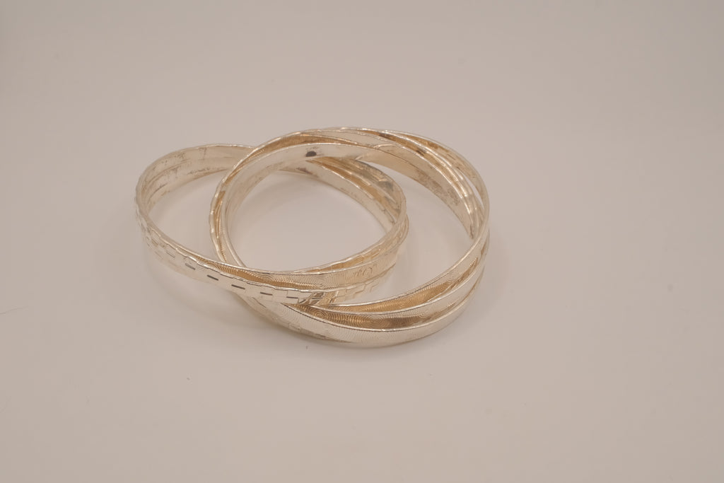 Silver tone rolling bangle bracelet