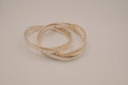 Silver tone rolling bangle bracelet
