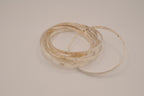 Silver tone rolling bangle bracelet
