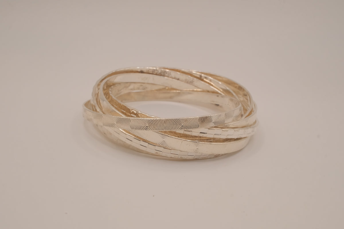 Silver tone rolling bangle bracelet
