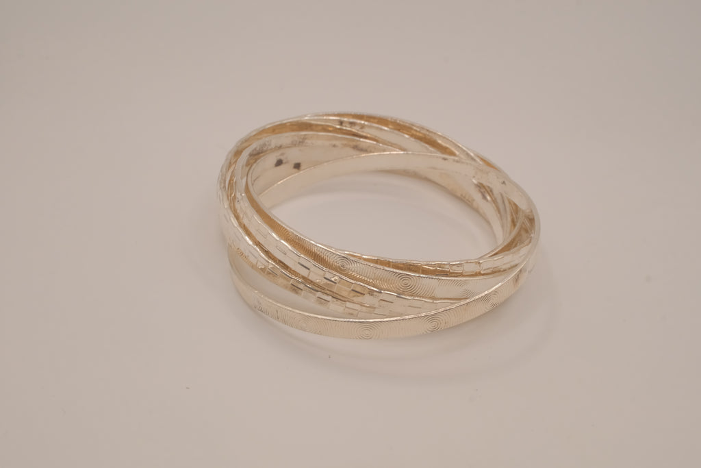 Silver tone rolling bangle bracelet