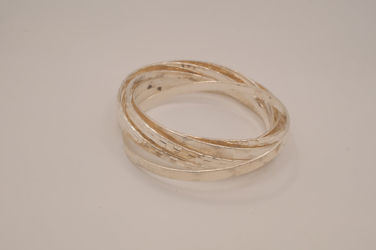 Silver tone rolling bangle bracelet