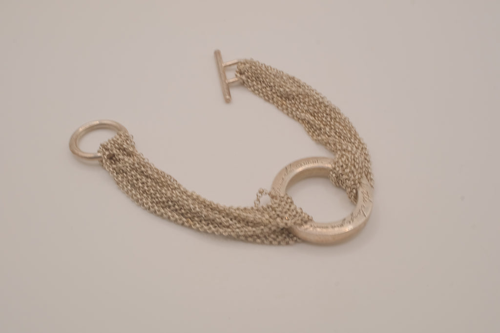Multi-strand chain quote bracelet