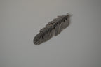 Vintage silver-toned feather pendant