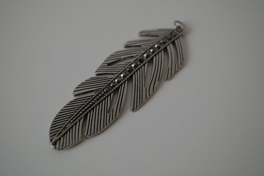 Vintage silver-toned feather pendant