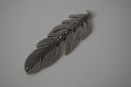 Vintage silver-toned feather pendant
