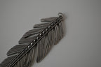Vintage silver-toned feather pendant