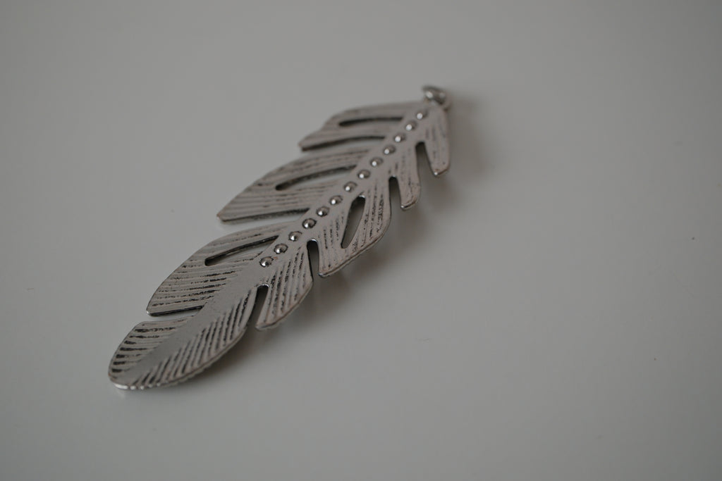 Vintage silver-toned feather pendant