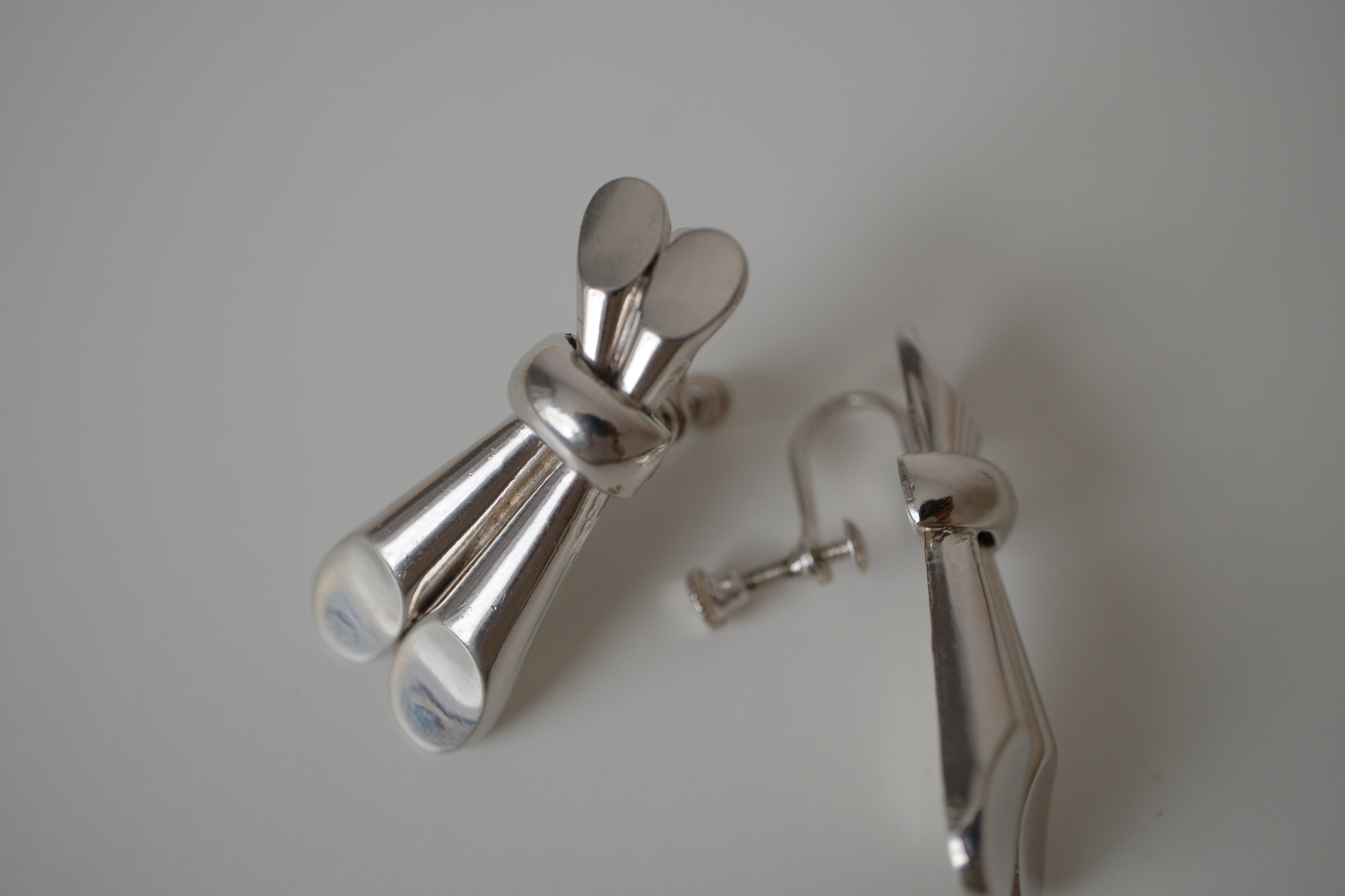 Vintage Coro Silver toned knot-design screw back earrings