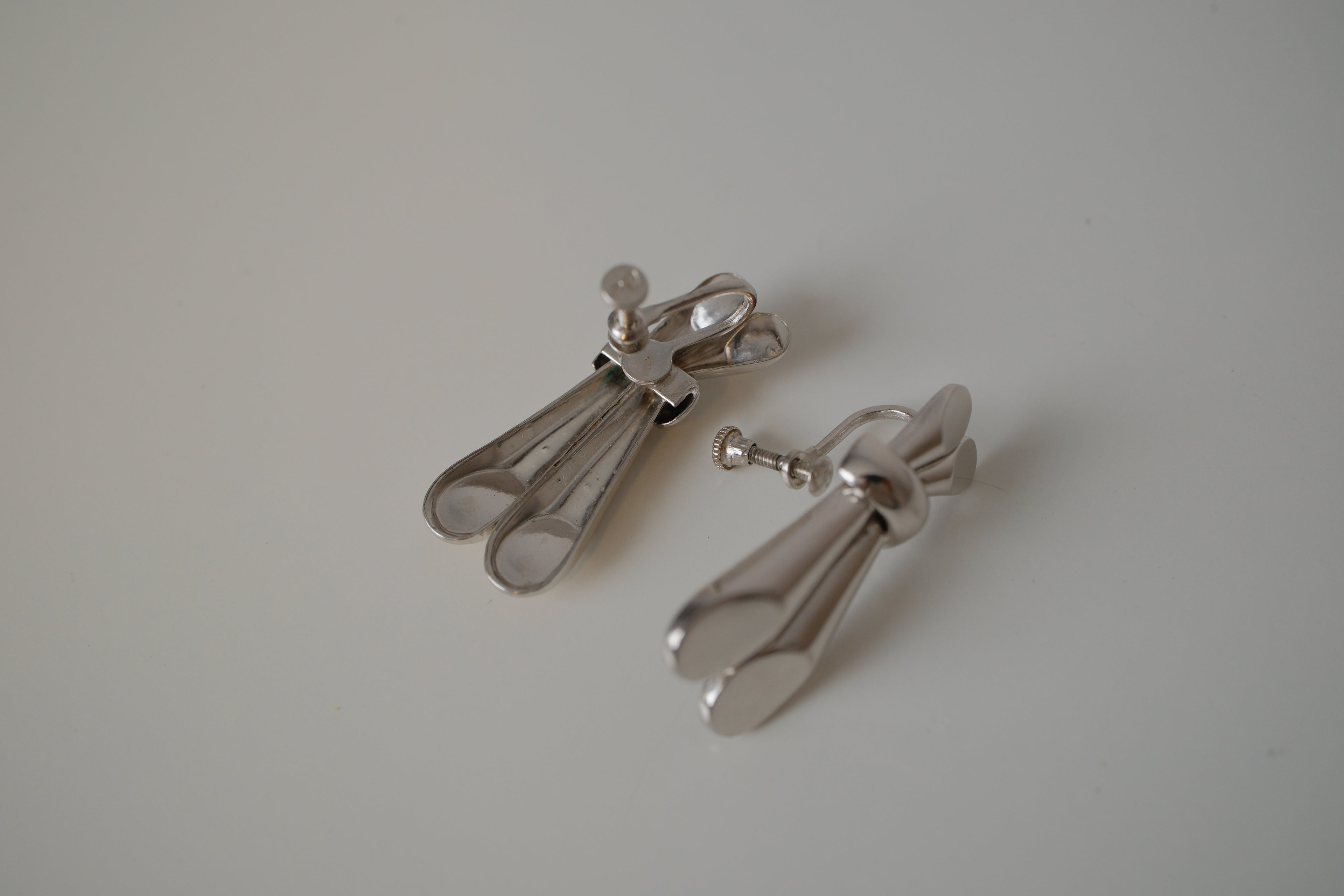 Vintage Coro Silver toned knot-design screw back earrings