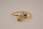 Vintage Avon gold-tone calla lily hinged bangle bracelet