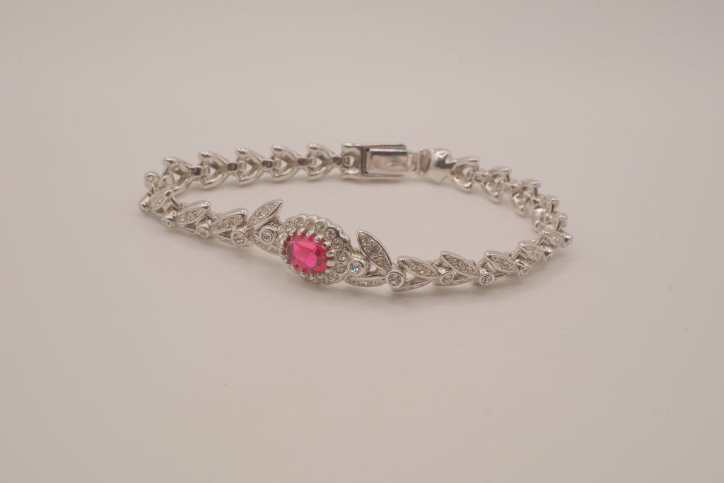 Oval-cut red stone tennis bracelet