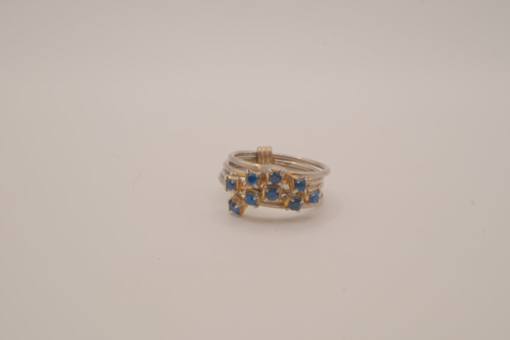 Vintage multi-band harem ring featuring blue stones