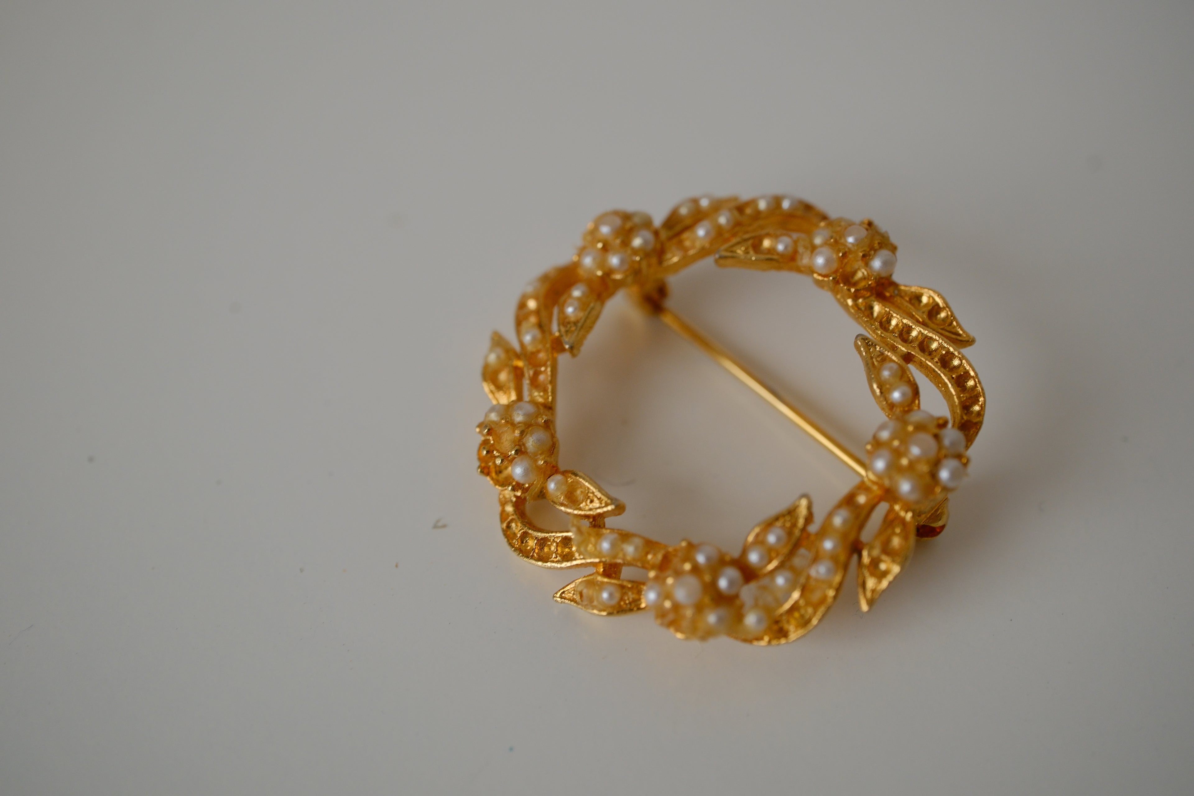 Vintage Coro gold-toned wreath brooch