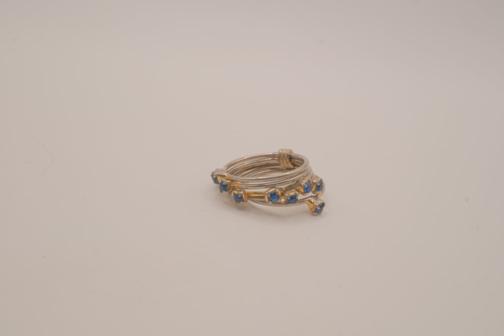 Vintage multi-band harem ring featuring blue stones