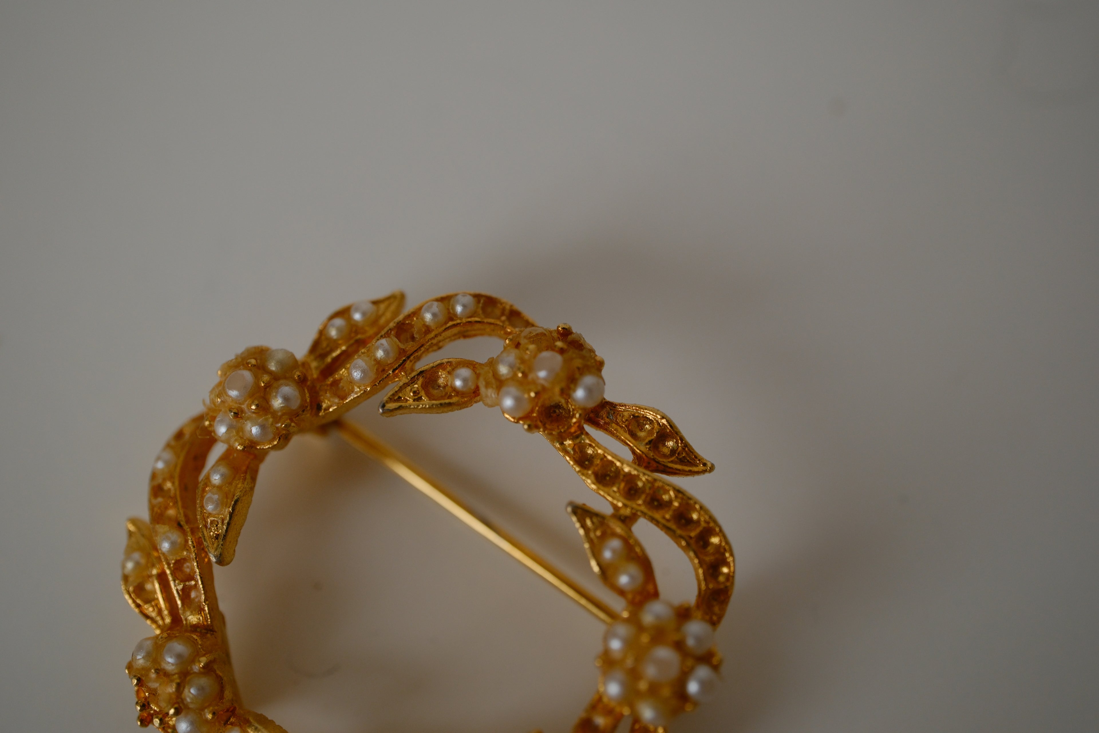 Vintage Coro gold-toned wreath brooch