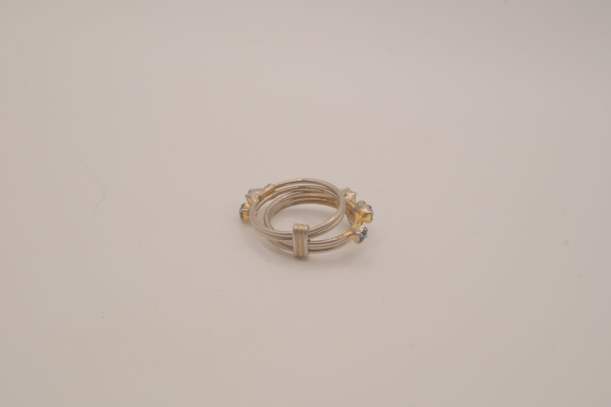 Vintage multi-band harem ring featuring blue stones