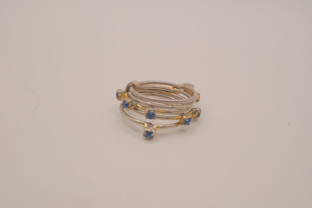Vintage multi-band harem ring featuring blue stones
